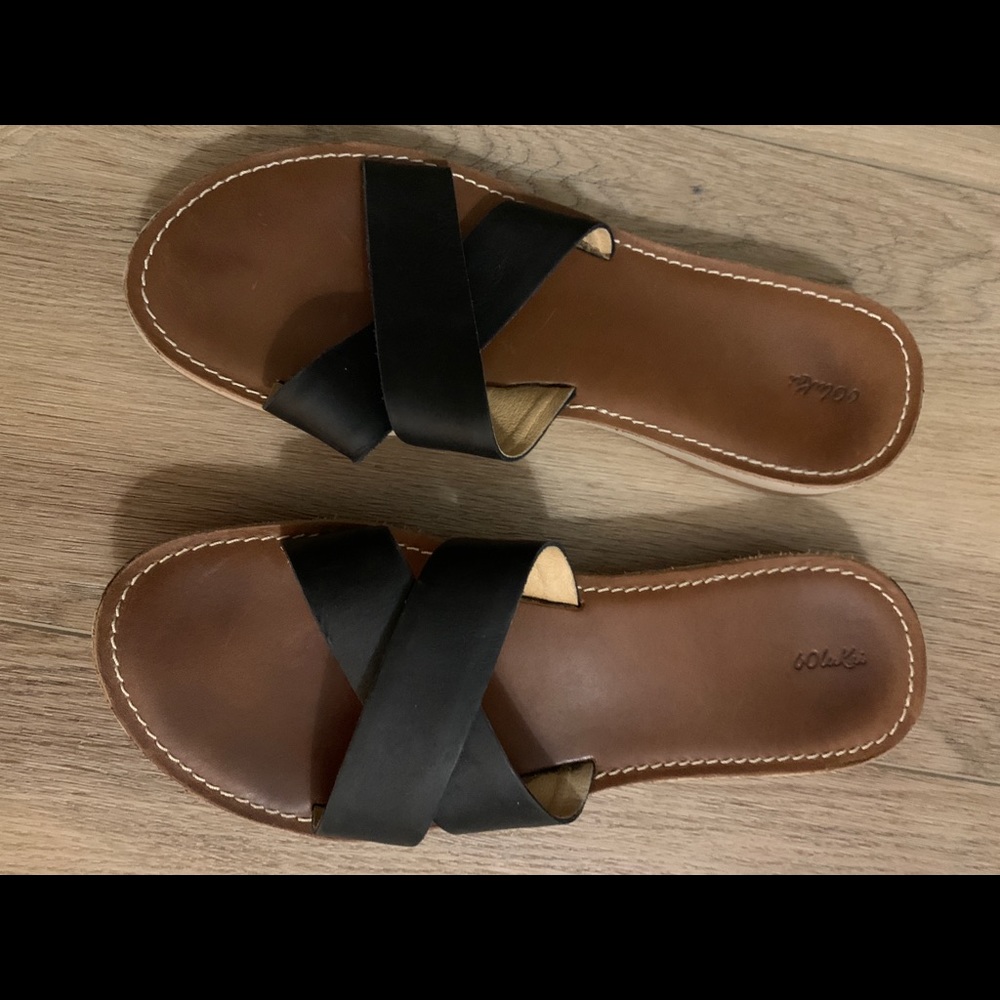 Olukai black leather flip flops